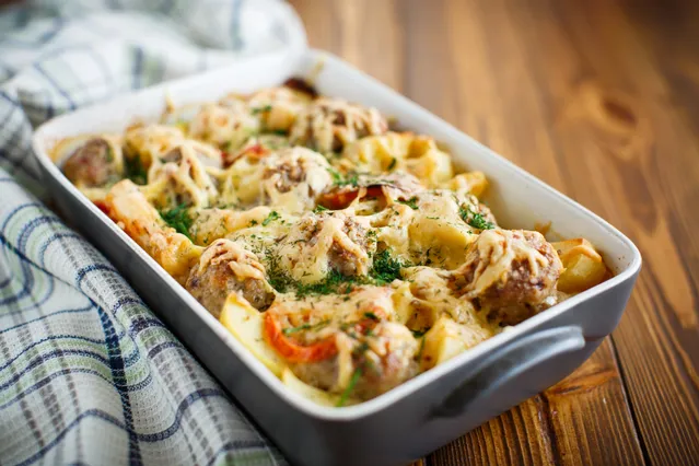 A creamy baked chicken casserole with herbs and cheese.