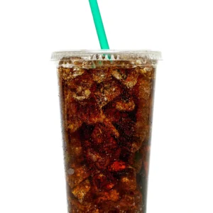 A clear plastic cup filled with iced cola and a green straw.